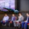 Microphone in front businesspeople blurred in conference meeting room