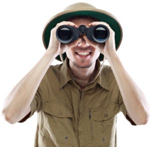Safari man looking through binoculars