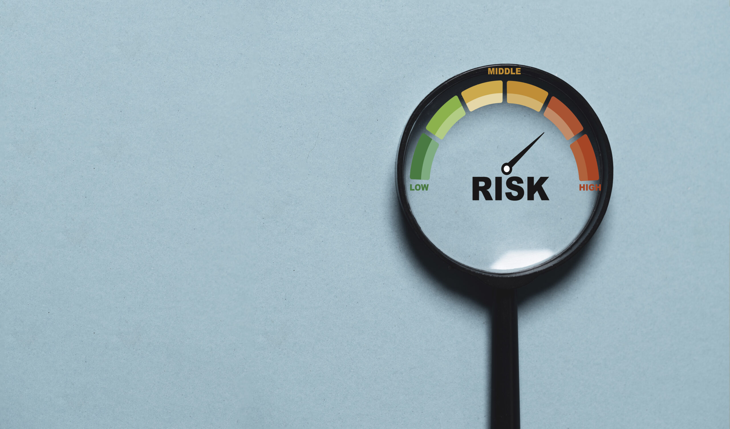 Risk level indicator rating since low to high inside of magnifier glass for Risk management and assessment