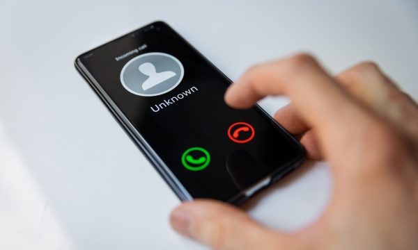 smartphone with incoming call from unknown person