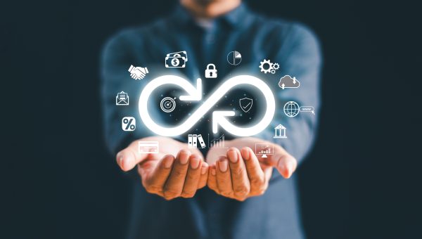 Business technology data link network concept. Businessman Hand show virtual infinity loop technology marketing online icon symbol of endless connection
