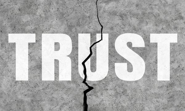 Broken trust concept with concrete wall.